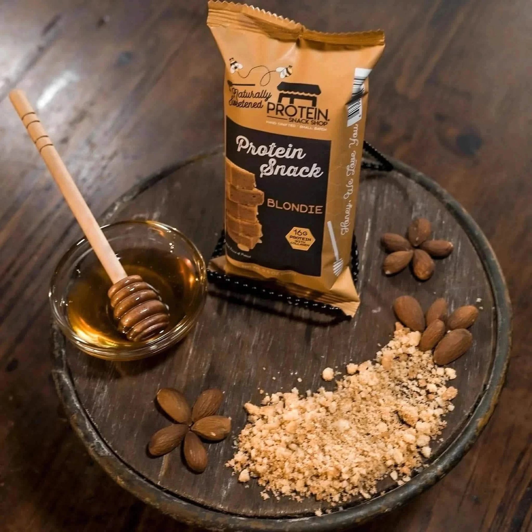 Top view package second of gourmet honey-sweetened blondie protein snack, 5-count, gluten-free and high-protein.