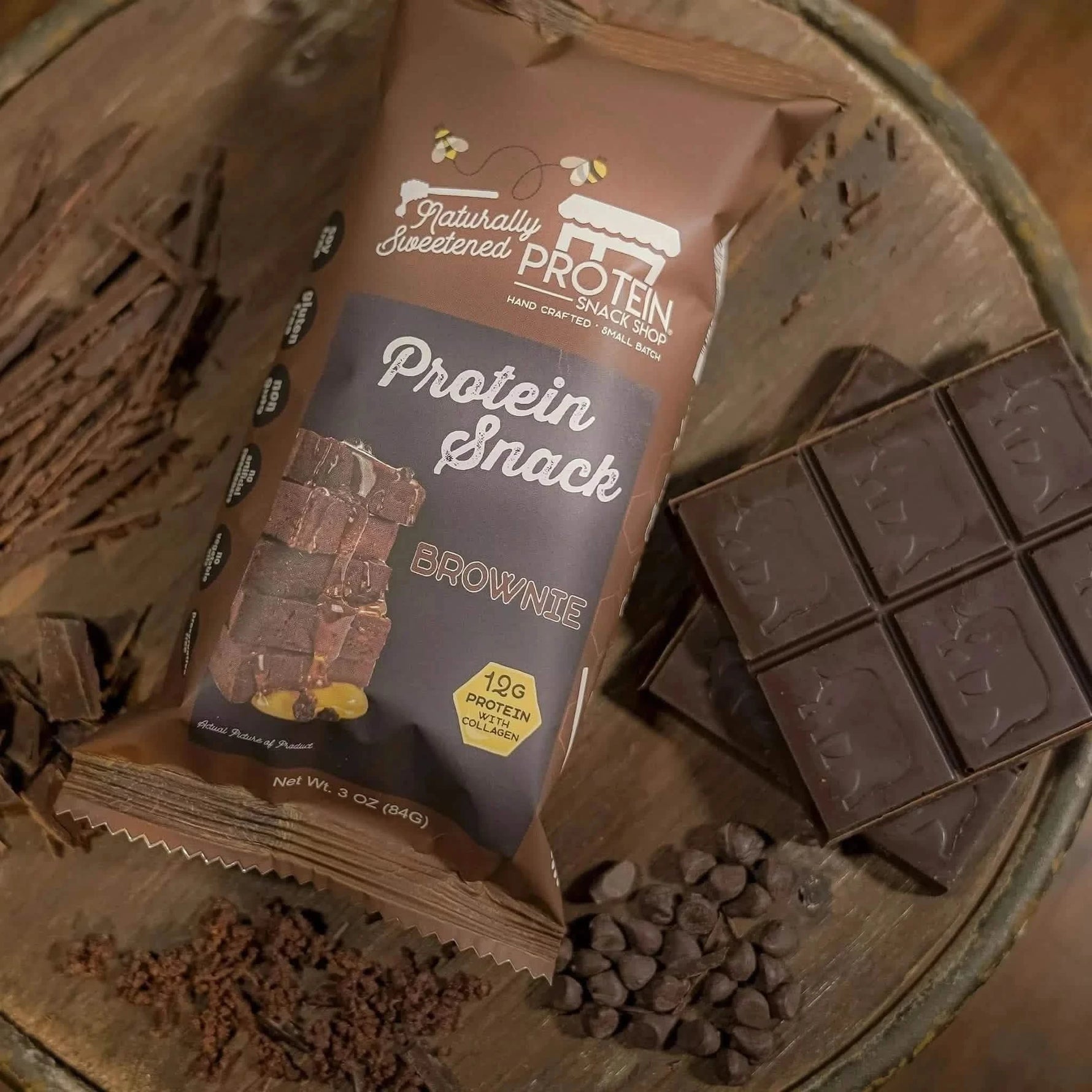 Top view package of gourmet honey-sweetened chocolate brownie protein snack, 5-count, gluten-free and high-protein.