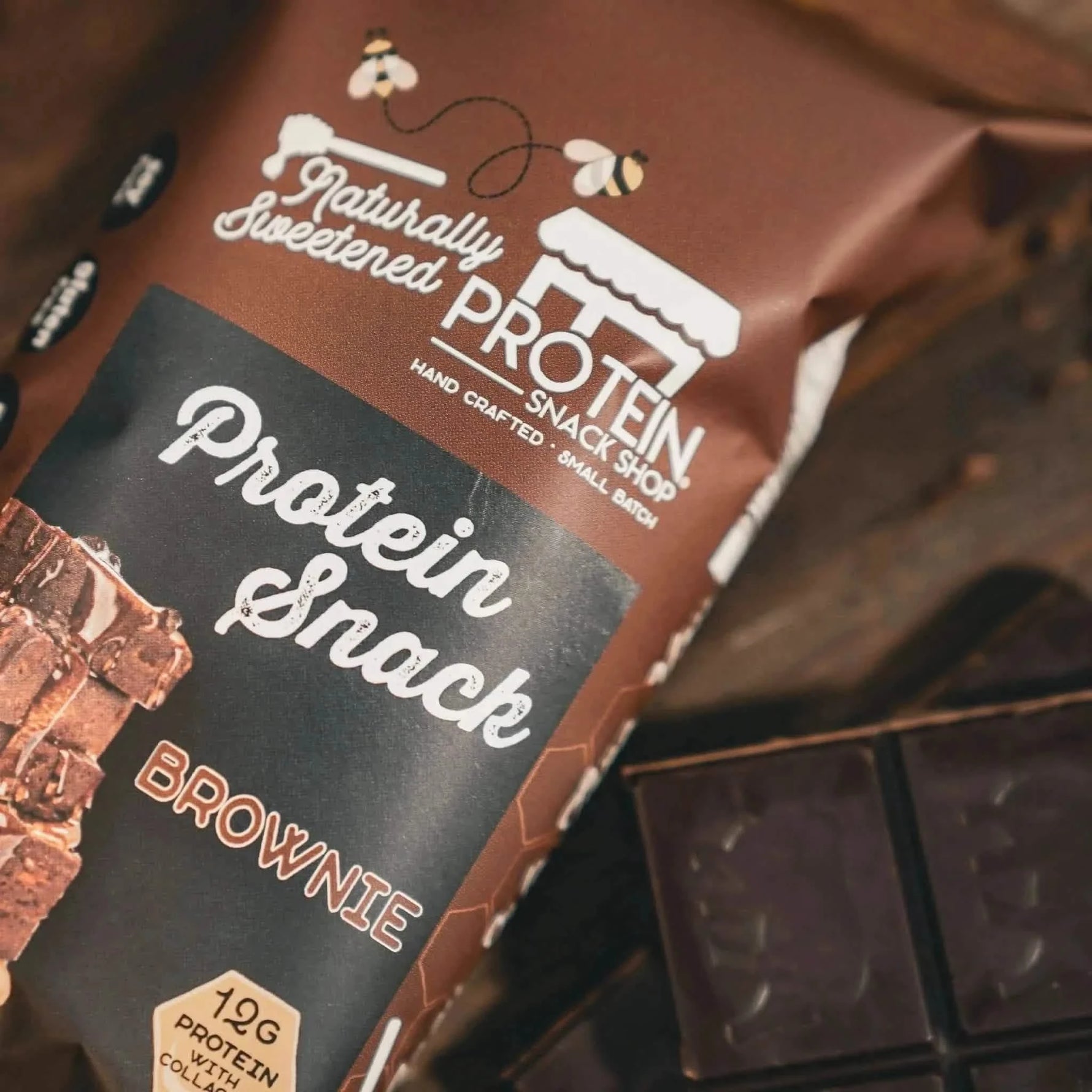 Top view package third of gourmet honey-sweetened chocolate brownie protein snack, 5-count, gluten-free and high-protein.