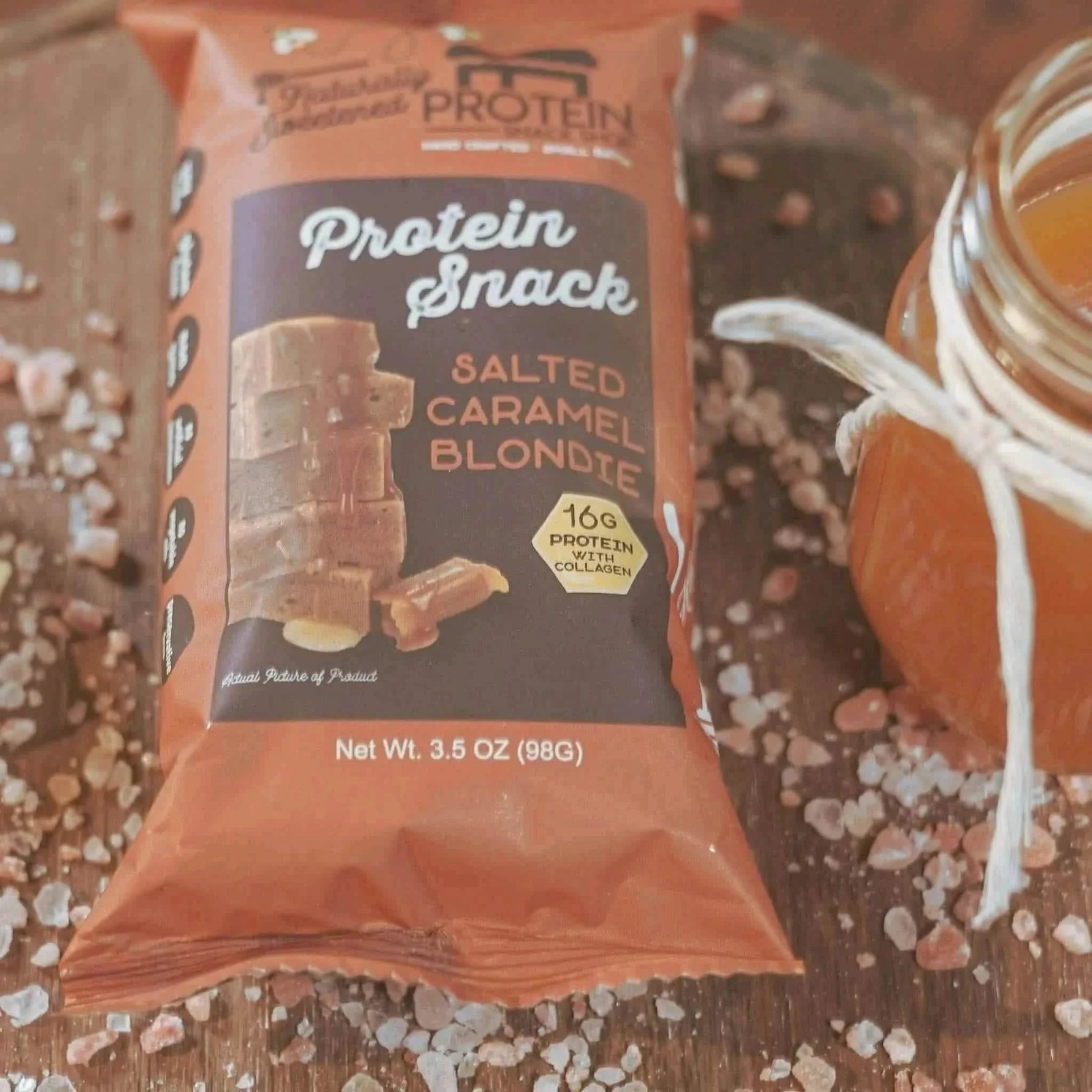 Top view package of gourmet honey-sweetened salted caramel blondie protein snack, 5-count, gluten-free and high-protein.