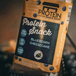Front view package of blueberry cheesecake protein snack, 5-count, gluten-free and keto-friendly.