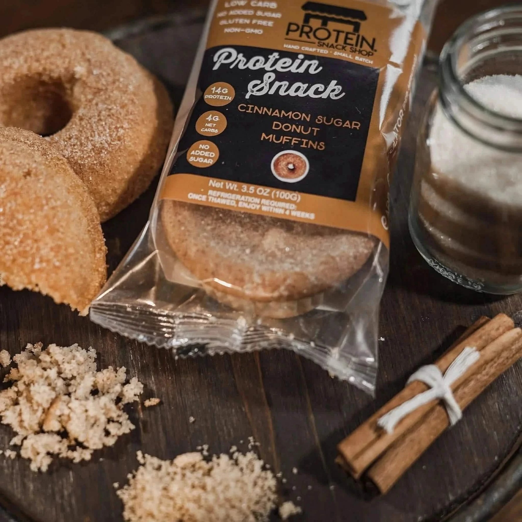 Top view package second of gourmet low-carb cinnamon donut muffin protein snack, 5-count, gluten-free and keto-friendly.