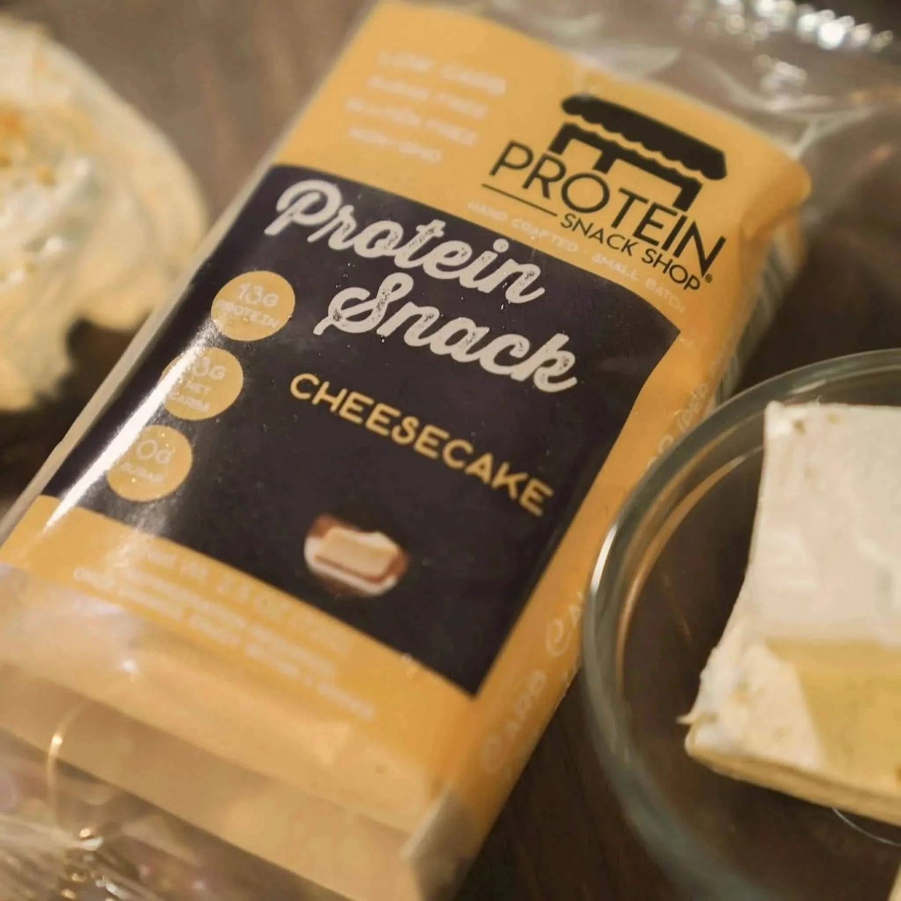 Top view package third of original cheesecake protein snack, 5-count, gluten-free and keto-friendly.