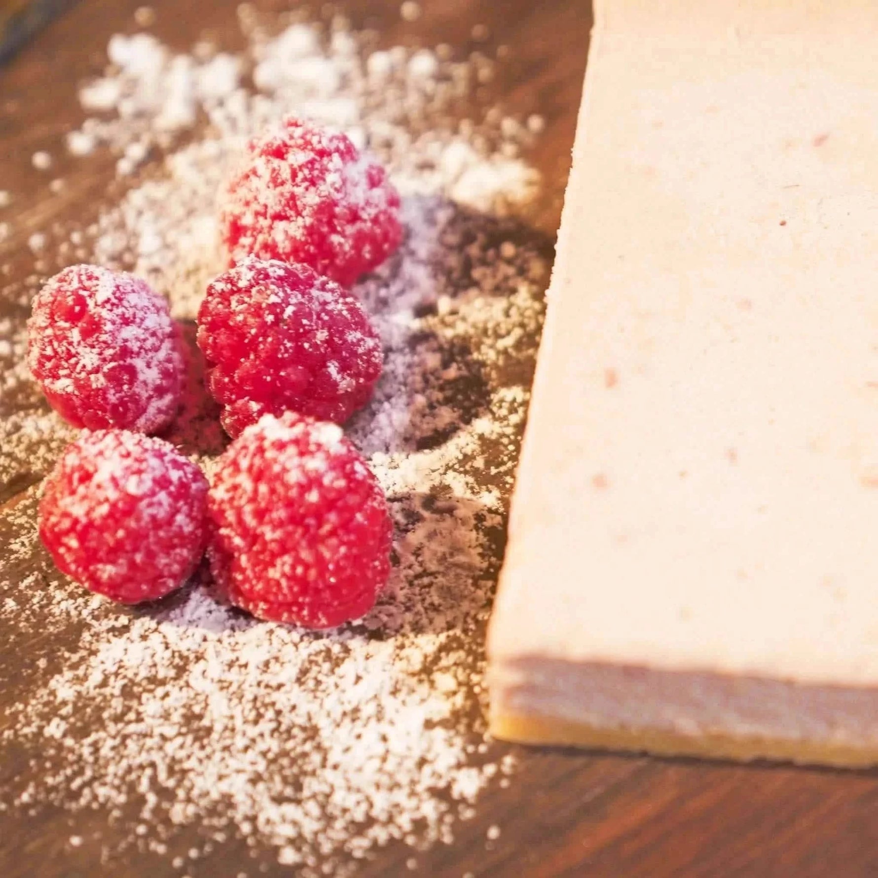 Raw picture of raspberry cheesecake protein snack, 5-count, gluten-free and keto-friendly.