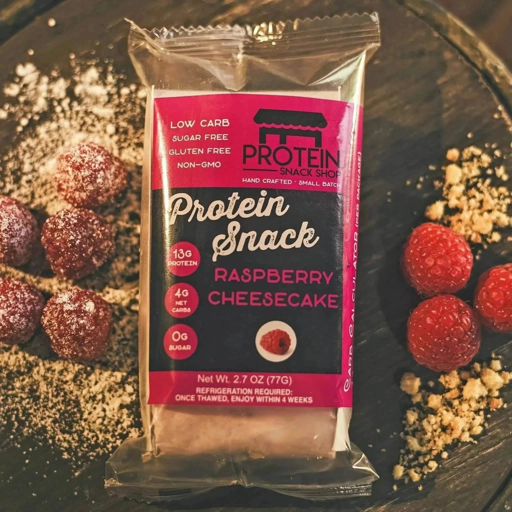 Top view package of raspberry cheesecake protein snack, 5-count, gluten-free and keto-friendly.