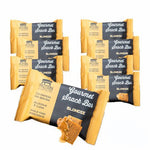 Eight gluten-free, high-protein Blondie Bars from Protein Snack Shop arranged together in clean, honey-sweetened packaging.