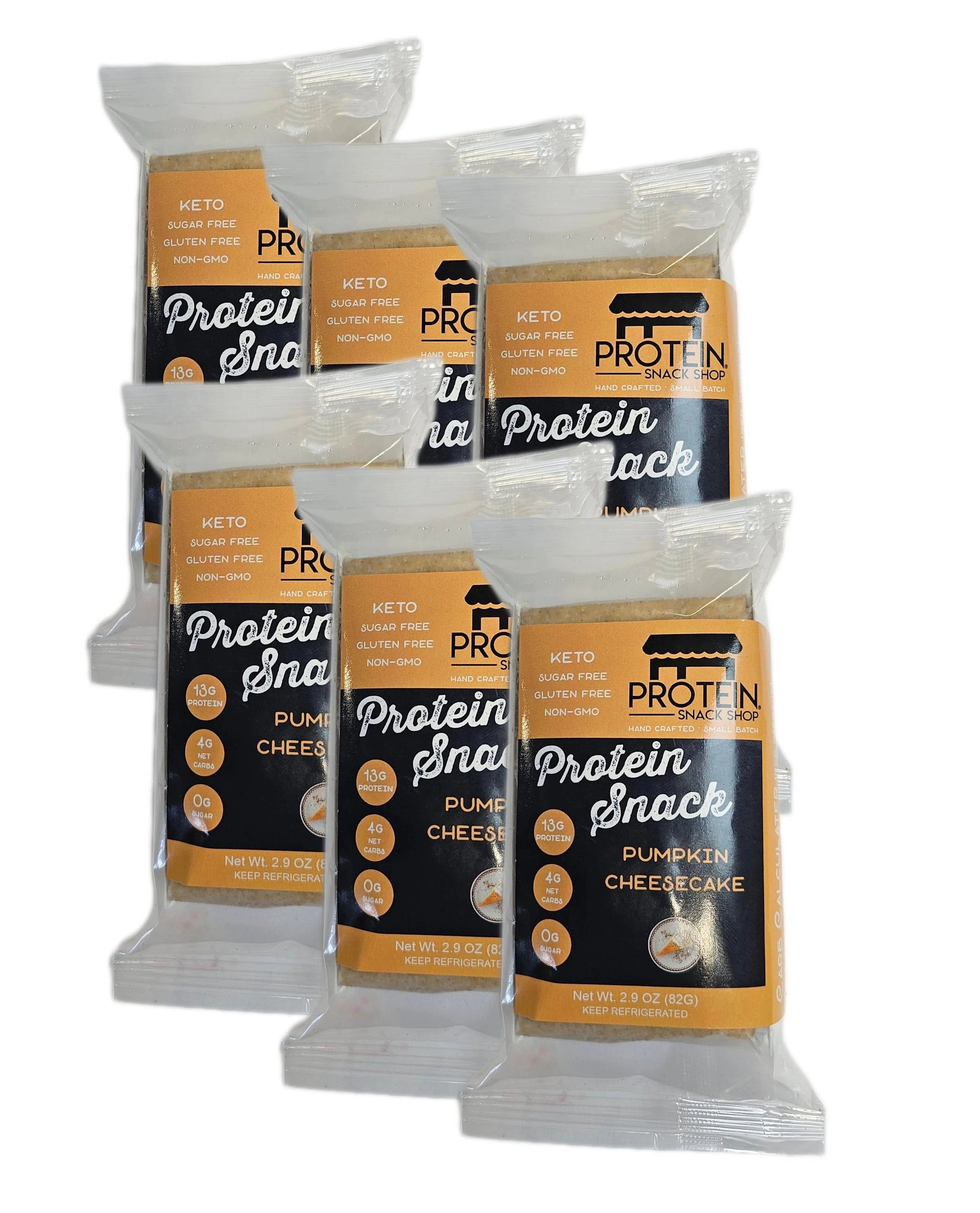 Six individually wrapped Protein Snack Shop Pumpkin Cheesecake bars arranged together, gluten-free labels and 13g protein per serving.