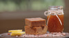 A close-up video of Protein Snack Shop’s Salted Caramel Blondie drizzled with caramel and topped with pink Himalayan salt, with salt crystals slowly falling for a mouthwatering effect.